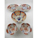 A pair of Chinese hard paste porcelain charges, decorated in the Imari palette, together with