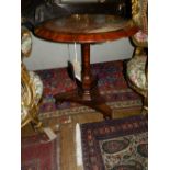 A 19th century rosewood circular centre table, having marble top, raised on trefoil base. H.74cm D.