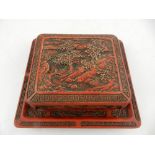 A Chinese cinnabar box and cover with tray base