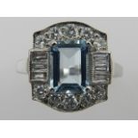 An 18 carat white gold, diamond, and aquamarine ring, in the Art Deco taste,