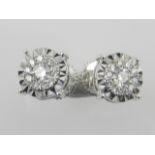 A pair of 18ct white gold diamond cluster earrings with screw back fittings, 0.