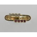An unusual yellow metal, diamond, and ruby ring, in the Modernist taste,