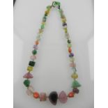 An unusual precious and semi-precious hardstone necklace, comprising of jade, quartz, tourmaline,