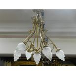 A Regency style gilt brass seven light electrolier, with opalescent flambe shades. H.