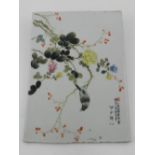 A 20th century Chinese porcelain panel, depicting flora and fauna, having character marks. H.32cm W.