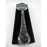A novelty crystal glass handled magnifying glass, boxed as new. L.