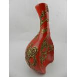 A Chinese red ground vase, decorated with pink dragons. H.