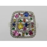 An unusual 14 carat white gold, diamond, multicoloured sapphire, citrine, and ruby ring,