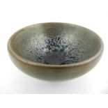 A Chinese Jian kiln tea bowl, glazed in black and brown.H.4.5cm