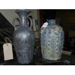 A blue glazed three handled vase, together with one other ovoid formed vase, painted in blue,