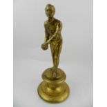 A late 19th century gilt bronze figural study of a gentleman with ball.