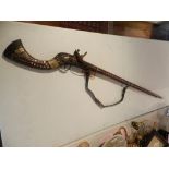 A 19th century Middle Eastern camel musket rifle.