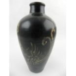 A Chinese Jixhou kiln vase, of ovoid form decorated with stylised birds and flowers on a black