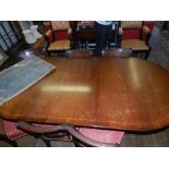 A 19th century style mahogany D-end dining table having one extra leaf.