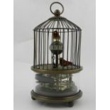 A clock in the form of a birdcage.