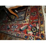 A carpet, possibly Turkish (?), the centre having four rows of squares having floral decoration,