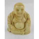 A Chinese ivory study of a seated Buddha.