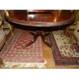 A Regency mahogany breakfast table, having gadrooned circular top,