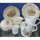 Five pieces of Royal Doulton Bunnykins nursery ware, including money box,