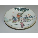 A 19th Century Chinese famille rose saucer dish decorated with four leisurely courtesans in garden