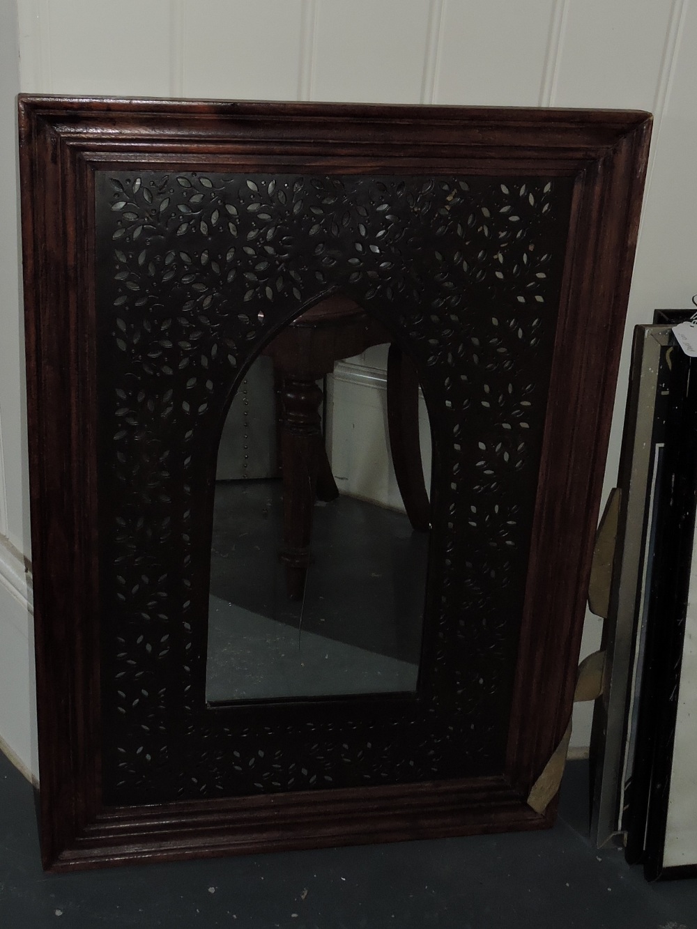 A Moorish style rectangular wall mirror, with pierced petal slip insert, H. 75cm.