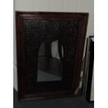 A Moorish style rectangular wall mirror, with pierced petal slip insert, H. 75cm.