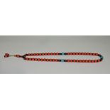 A coral and turquoise bead necklace, L. 66cm.