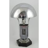 A 1930s Jaeger Le Coultre Luxhora chrome table lamp with domed shade over a twin dial,