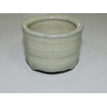 A celadon crackle glaze water pot, with a ribbed body on a foot rim, D. 7cm.