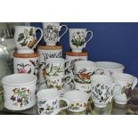Three Portmerion storage jars, two jardiniere, various mugs and cups and saucers.