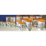 A set of seventeen Portmeirion 'Botanic Garden' pattern storage jars of various sizes with turned