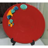 A Poole Pottery Odyssey pattern charger, decorated with splashes of turquoise,