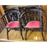 A pair of small doll size Windsor smokers bow chairs with buttoned and padded seats above turned