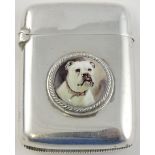 A Victorian silver vesta case applied with a circular enamelled boss depicting a boxer dog,