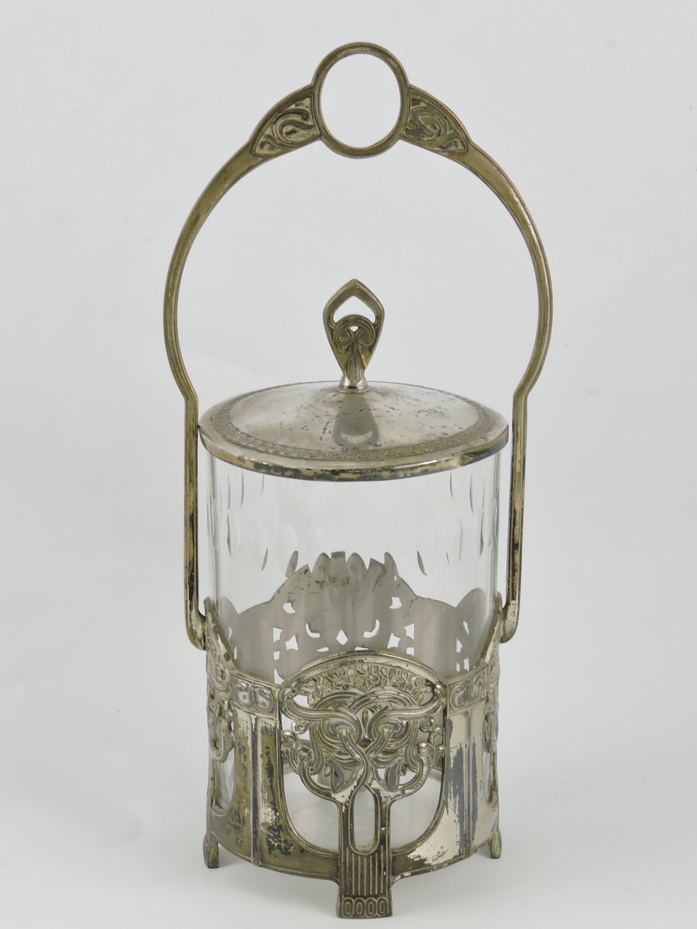 A WMF Art Deco style biscuit barrel, with a clear glass cylindrical liner, H. 30cm.