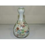 A famille rose gourd type vase, decorated with an interior scene, H. 18cm.