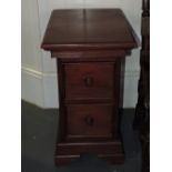 A pair of reproduction hardwood two drawer bedside chests, H. 66cm.