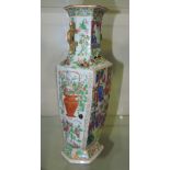 A Chinese 19th Century twin handled hexagonal shape famille rose vase decorated with a gathering of