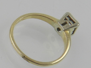 A yellow metal and diamond ring, set single stone, the shank stamped 14K. - Image 2 of 2