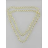 An opera length pearl necklace, together with a 14 carat yellow gold, pearl,