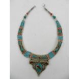 A white metal, coral, and turquoise beaded necklace, together with another similar three strand