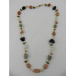 An amber necklace, together with a hardstone and quartz beaded necklace.