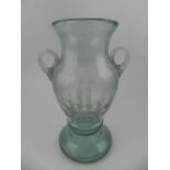 A 19th century twin-handled soda glass vase, having etched design of a ship to front. H.