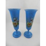 A pair of Victorian blue opaline glass vases, painted with flowers.