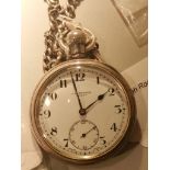 J. W. Benson, London. A silver cased pocket watch with albert chain.