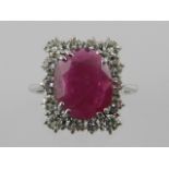 A white metal, diamond, and ruby set cluster ring,