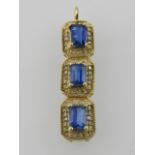 A yellow metal, diamond and blue stone set pendant,