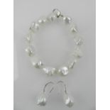 An 18 carat white gold and South Sea pearl set bracelet, the clasp stamped 750,