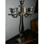 A chrome five light four branch candelabra.