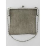 An early 20th century silver chain link ladies evening bag, bearing inscription to frame.